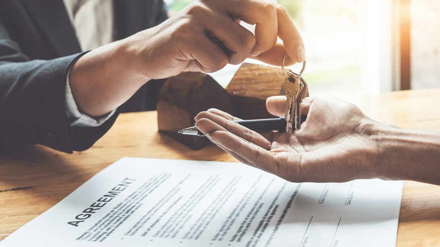 Hand handing keys over to open hand